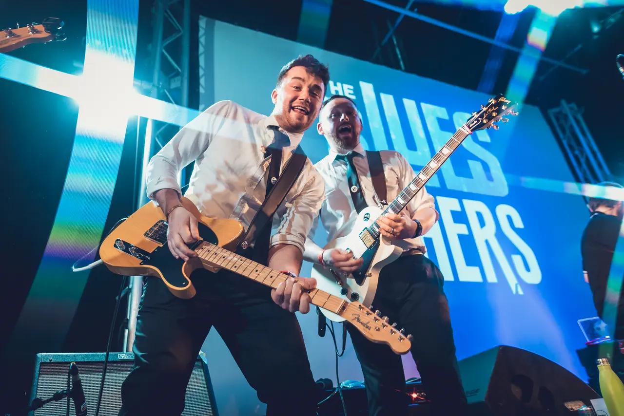 The Blues Others' two guitarists playing live on stage