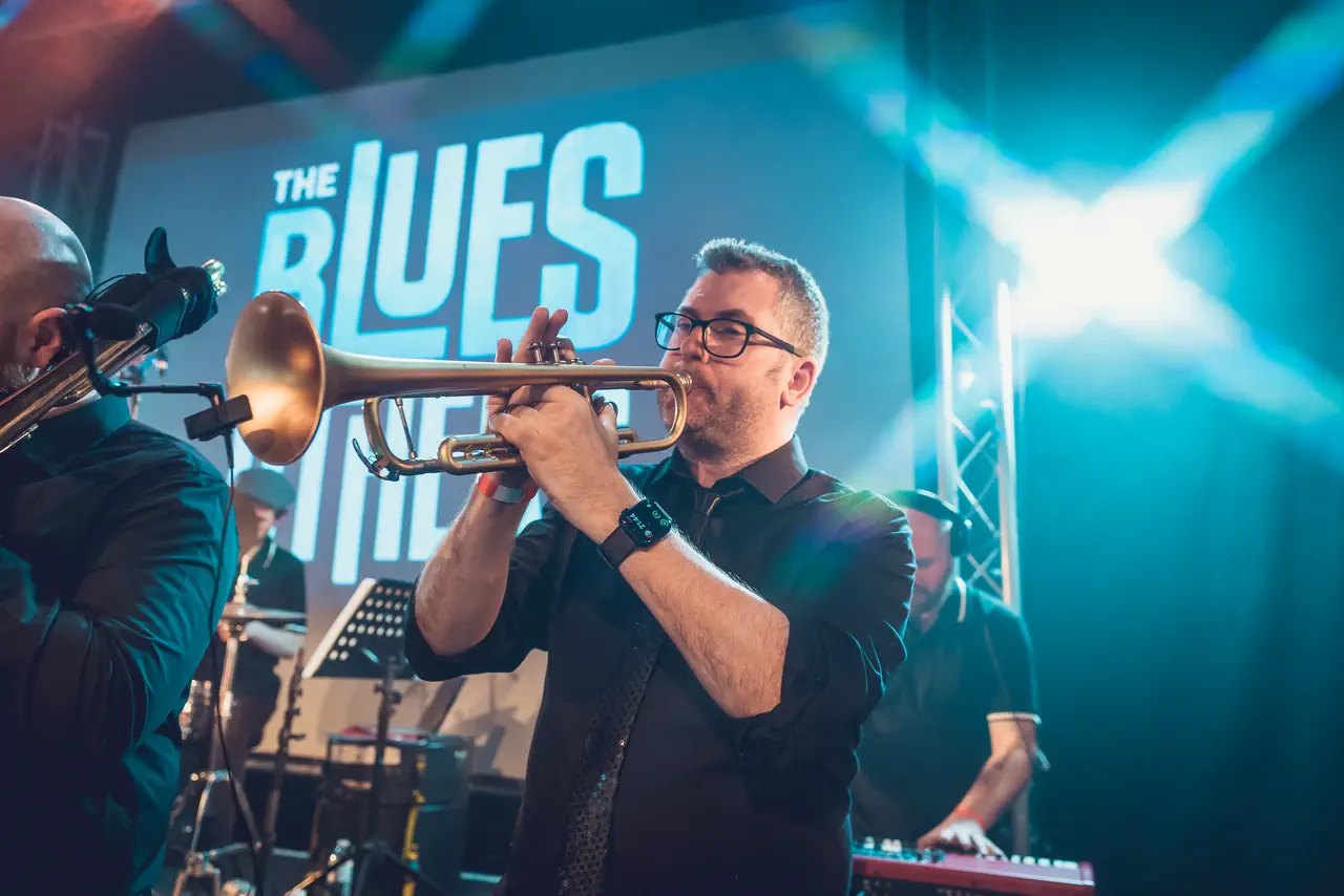 Trumpet player from The Blues Others' horn section performing live